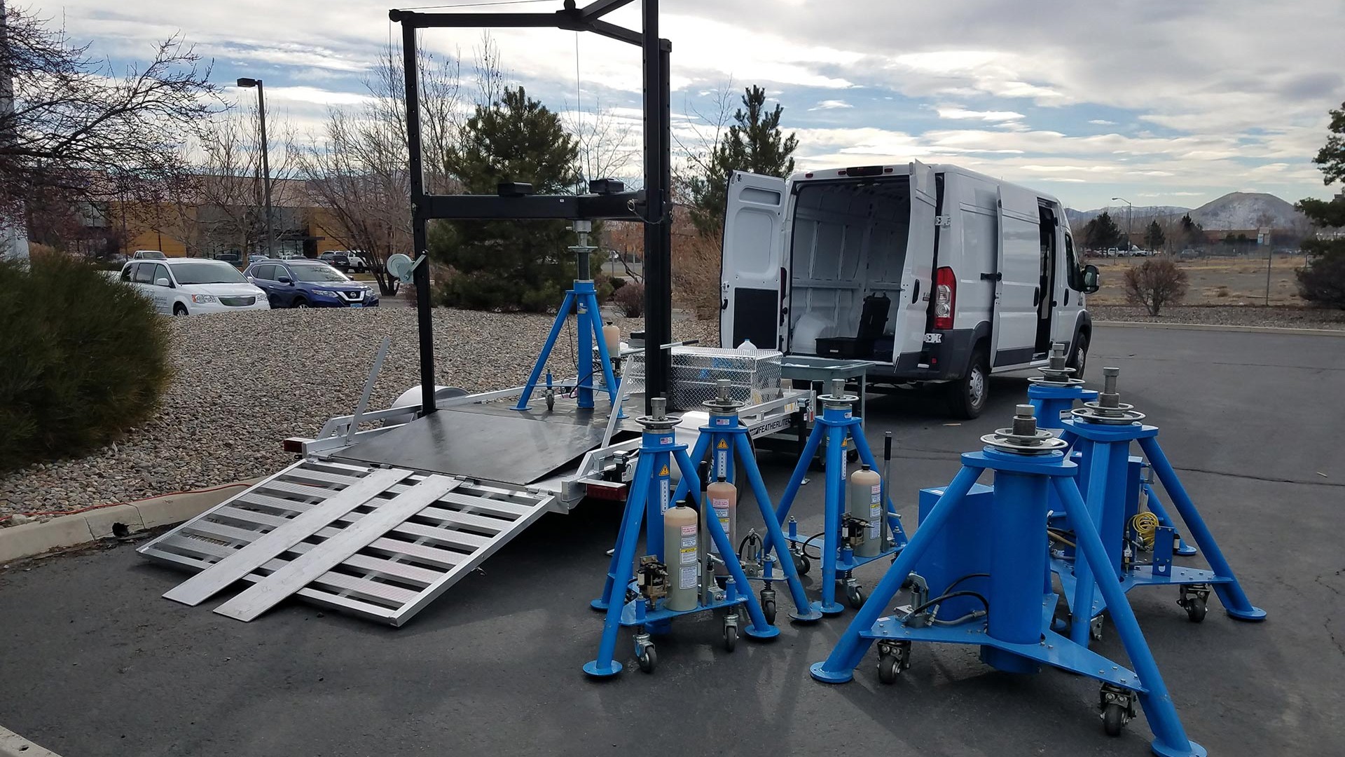 Mobile aircraft jack load calibration equipment being pulled on a trailer for on-site calibration